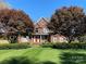 Brick house with a two-car garage, a welcoming porch, and manicured lawn at 103 Berea Baptist Church Rd, Stanfield, NC 28163