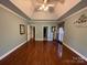 Large main bedroom with hardwood floors and tray ceiling at 103 Berea Baptist Church Rd, Stanfield, NC 28163