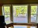View of deck, patio, and lush backyard from inside at 103 Berea Baptist Church Rd, Stanfield, NC 28163