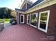 Wooden deck overlooks backyard; brick exterior and string lights at 103 Berea Baptist Church Rd, Stanfield, NC 28163