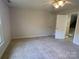 Bedroom with carpet, ceiling fan and access to upper level at 103 Berea Baptist Church Rd, Stanfield, NC 28163