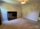 Bedroom with carpet, ceiling fan, and built-in entertainment center at 103 Berea Baptist Church Rd, Stanfield, NC 28163