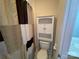 Simple bathroom with shower/tub combo and linen cabinet at 103 Berea Baptist Church Rd, Stanfield, NC 28163