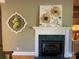 Elegant fireplace with decorative mantel and artwork at 103 Berea Baptist Church Rd, Stanfield, NC 28163