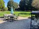 Large patio with table and chairs, and hanging swing at 103 Berea Baptist Church Rd, Stanfield, NC 28163