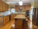 Spacious kitchen with granite countertops, stainless steel appliances, and an island at 103 Berea Baptist Church Rd, Stanfield, NC 28163