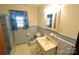 Bathroom with light blue tile, vanity, and shower/tub combo at 2427 Rhyneland St, Gastonia, NC 28054