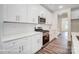 White shaker cabinets, quartz countertops, and stainless steel appliances at 5107 Heathland Dr # 49, Charlotte, NC 28215