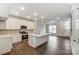 Bright, open kitchen featuring white cabinetry, stainless steel appliances, and an island at 5540 Stafford Rd # 31, Charlotte, NC 28215