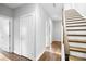 Bright hallway with hardwood floors and modern staircase at 916-A Westbrook Dr, Charlotte, NC 28202