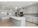 Modern kitchen with gray cabinets, island, and stainless steel appliances at 1702 Blanche St, Charlotte, NC 28262