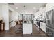 Open concept kitchen with island, stainless steel appliances, and white cabinetry at 1706 Blanche St, Charlotte, NC 28262