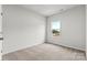 Simple bedroom with carpeted floors and a window at 1710 Blanche St, Charlotte, NC 28262