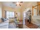 Two-story living room with hardwood floors and fireplace at 212 Primrose Walk, Fort Mill, SC 29715