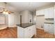 Kitchen island and hardwood floors at 4094 Deerfield Nw Dr, Concord, NC 28027