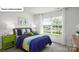 Bright bedroom with a double bed and green nightstand at 114 Meadow View Dr, Statesville, NC 28677