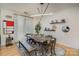 Modern dining room with a long wooden table and stylish light fixture at 1000 E Woodlawn Rd # 415, Charlotte, NC 28209