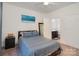 Spacious bedroom with a double bed and ensuite bathroom access at 1000 E Woodlawn Rd # 415, Charlotte, NC 28209