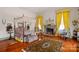 Spacious bedroom featuring a four-poster bed, fireplace and ornate rug at 104 Leslie Loop, Mooresville, NC 28115