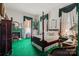 Comfortable bedroom with a four-poster bed and green carpet at 104 Leslie Loop, Mooresville, NC 28115