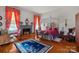 Charming bedroom with a four-poster bed, fireplace and red curtains at 104 Leslie Loop, Mooresville, NC 28115