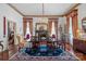 Formal dining room featuring a large table, hardwood floors and fireplace at 104 Leslie Loop, Mooresville, NC 28115