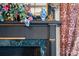 Detailed mantelpiece with decorative vase and floral arrangement at 104 Leslie Loop, Mooresville, NC 28115
