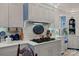 Spacious kitchen featuring white cabinets, a brick backsplash, and stainless steel appliances at 104 Leslie Loop, Mooresville, NC 28115