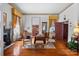 Elegant living room with hardwood floors, fireplace, and antique furnishings at 104 Leslie Loop, Mooresville, NC 28115
