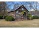 Rustic log cabin with quaint quilt squares at 104 Leslie Loop, Mooresville, NC 28115