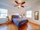 Spacious bedroom with hardwood floors and large windows at 1225 Fieldstone Rd, Mooresville, NC 28115