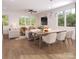 Open concept dining area with farmhouse table and living room views at 1624 Wildlife Rd, Charlotte, NC 28214