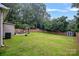 Large backyard with spacious lawn and storage shed at 5008 Unaka Ave, Charlotte, NC 28205