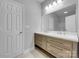 Bathroom with double vanity and light wood cabinets at 728 Jefferson Ave, Rock Hill, SC 29730