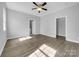Bright bedroom with ceiling fan and wood-look floors at 728 Jefferson Ave, Rock Hill, SC 29730