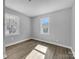 Bright and airy bedroom with neutral walls and wood-look flooring at 728 Jefferson Ave, Rock Hill, SC 29730