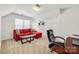 Relaxing sitting area with red sectional sofa and glass-top coffee table at 435 Riverwalk Nw Dr, Concord, NC 28027