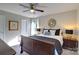 Bright bedroom with a double bed, nightstands, and ceiling fan at 6170 Hopewell Rd, Hickory Grove, SC 29717