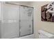 Bathroom with shower/tub combo and decorative anchor art at 806 Lake Mist Dr, Stanley, NC 28164