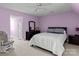 Bedroom with a queen-size bed and light purple walls at 806 Lake Mist Dr, Stanley, NC 28164