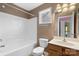 Small bathroom with tub, toilet and vanity at 129 Winterbell Dr, Mooresville, NC 28115