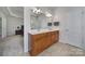 Double vanity bathroom with wood cabinets and updated fixtures at 26508 Sandpiper Ct, Fort Mill, SC 29707