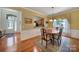 Formal dining room with hardwood floors and a view to the kitchen at 26508 Sandpiper Ct, Fort Mill, SC 29707