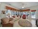 Sunroom with tiled floor, ample windows, and comfortable seating at 26508 Sandpiper Ct, Fort Mill, SC 29707