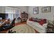 Home office featuring a built-in bookcase and sofa at 26508 Sandpiper Ct, Fort Mill, SC 29707