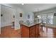 Bright kitchen breakfast area with hardwood floors and view to the hallway at 26508 Sandpiper Ct, Fort Mill, SC 29707