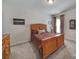 Bedroom with carpeted floor, wood furniture, and window at 26508 Sandpiper Ct, Fort Mill, SC 29707