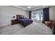 Main bedroom with carpeted floor, large window and ample space at 26508 Sandpiper Ct, Fort Mill, SC 29707