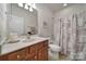 Clean bathroom with a tub, shower, and vanity at 26508 Sandpiper Ct, Fort Mill, SC 29707