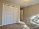 Bright bedroom with double-door closet and carpet flooring at 3837 Beauvista Dr, Charlotte, NC 28269